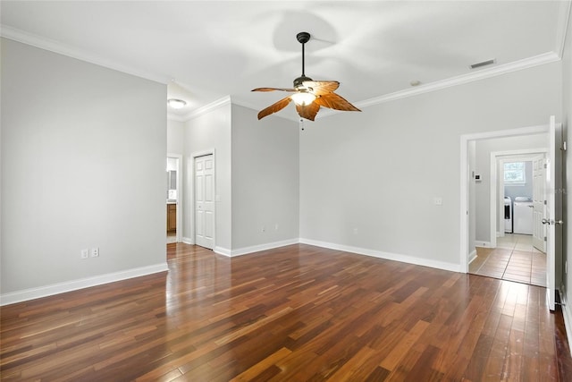 16609 NW 166th Dr, Alachua, FL 32615 - empty room with washing machine and dryer, ceiling fan, crown molding, and hardwood / wood-style floors