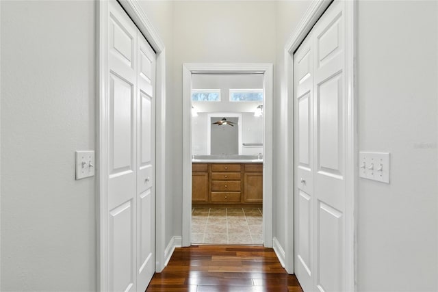 16609 NW 166th Dr, Alachua, FL 32615 - corridor featuring dark wood finished floors and baseboards