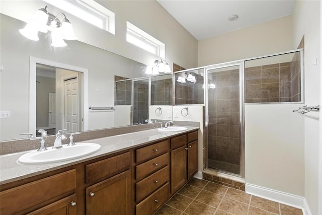 16609 NW 166th Dr, Alachua, FL 32615 - bathroom featuring a shower stall, double vanity, and tile patterned floors