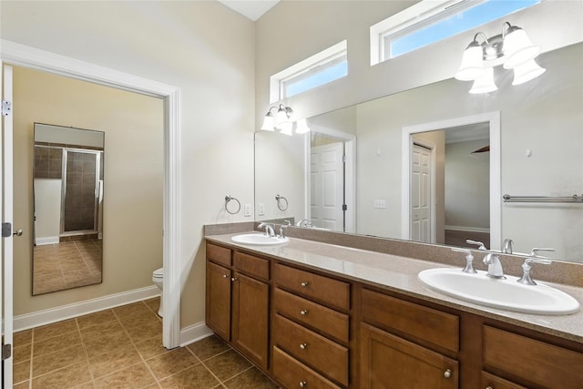 16609 NW 166th Dr, Alachua, FL 32615 - bathroom featuring double vanity, a shower, and tile patterned flooring