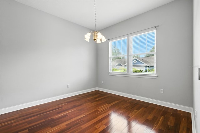 16609 NW 166th Dr, Alachua, FL 32615 - empty room featuring a chandelier and dark wood-style flooring