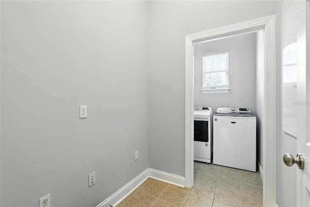 16609 NW 166th Dr, Alachua, FL 32615 - laundry room with washing machine and clothes dryer and light tile patterned floors