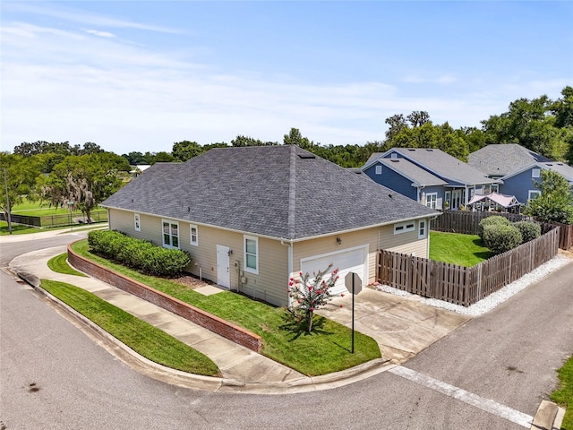 16609 NW 166th Dr, Alachua, FL 32615 - view of front of home featuring an attached garage, a shingled roof, and concrete driveway