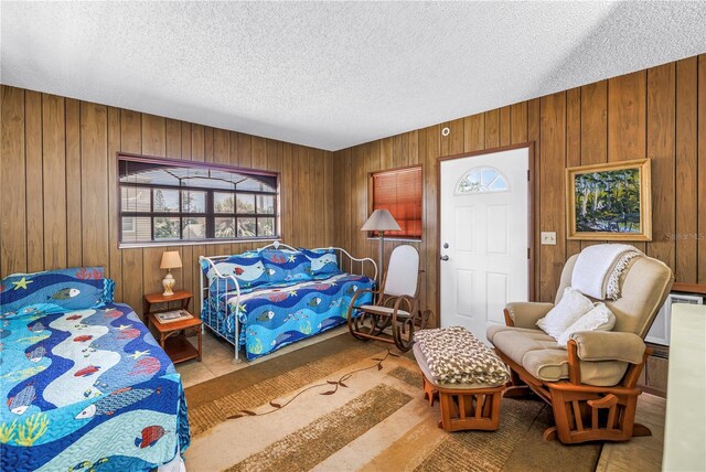 340 Bay Plz, Treasure Island, FL 33706 - bedroom with a textured ceiling and wood walls