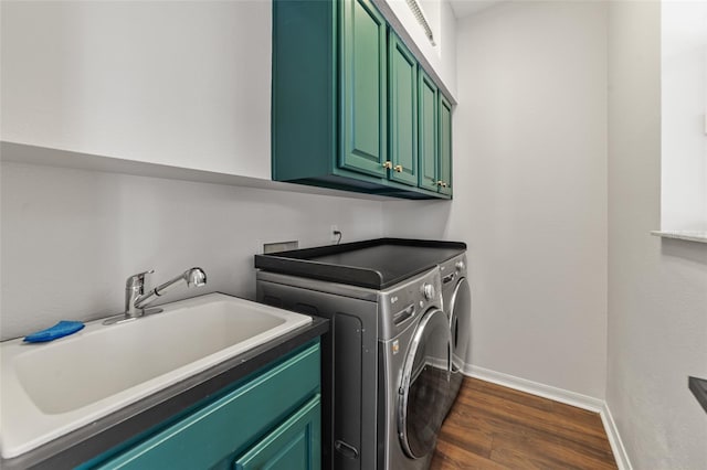2812 Windcrest Oaks Ct, Valrico, FL 33594 - washroom featuring cabinet space, washer and dryer, and dark wood-type flooring