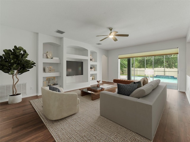2812 Windcrest Oaks Ct, Valrico, FL 33594 - living room featuring a ceiling fan, wood finished floors, and built in shelves