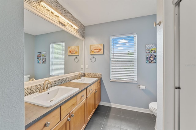2812 Windcrest Oaks Ct, Valrico, FL 33594 - bathroom featuring plenty of natural light, double vanity, and tile patterned floors