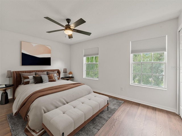 2812 Windcrest Oaks Ct, Valrico, FL 33594 - bedroom with wood finished floors and ceiling fan