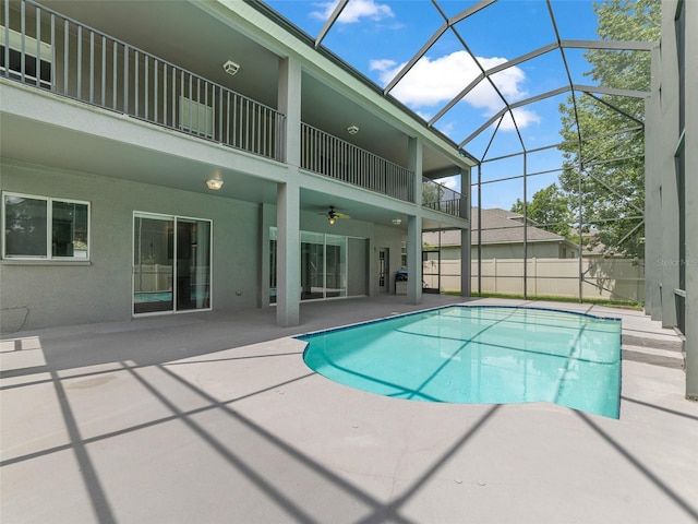 2812 Windcrest Oaks Ct, Valrico, FL 33594 - view of pool featuring a ceiling fan, a patio area, and glass enclosure