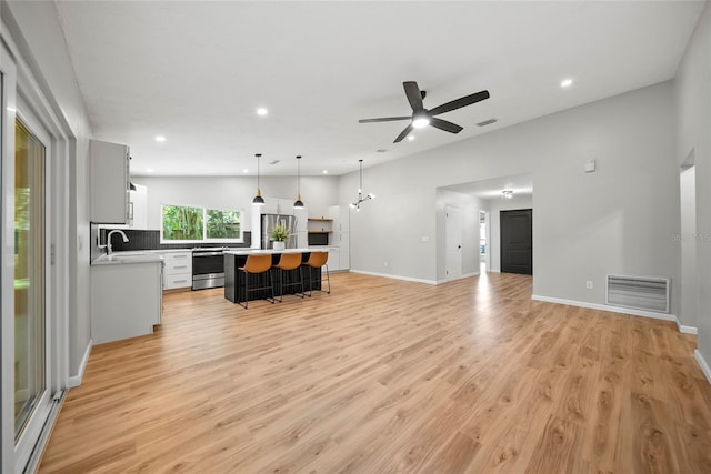 4639 Cabbage Palm Dr, Valrico, FL 33596 - living room featuring light wood-type flooring, a ceiling fan, and recessed lighting