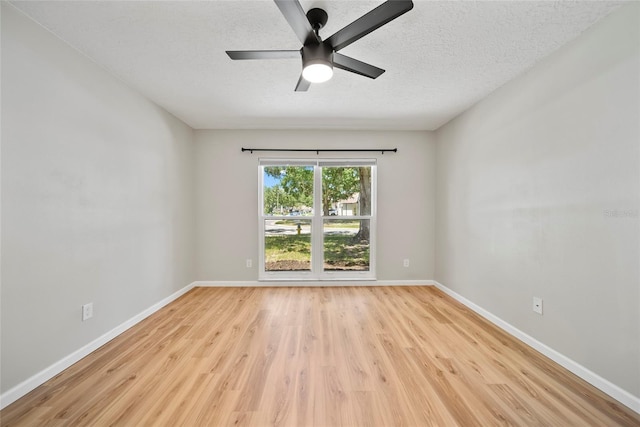 4639 Cabbage Palm Dr, Valrico, FL 33596 - unfurnished room featuring light wood finished floors, ceiling fan, and a textured ceiling