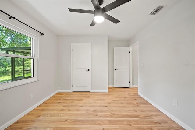 4639 Cabbage Palm Dr, Valrico, FL 33596 - unfurnished bedroom featuring light wood-style floors and ceiling fan