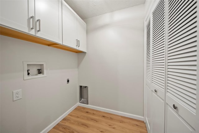 4639 Cabbage Palm Dr, Valrico, FL 33596 - washroom featuring hookup for a washing machine, cabinet space, electric dryer hookup, and light wood-style flooring