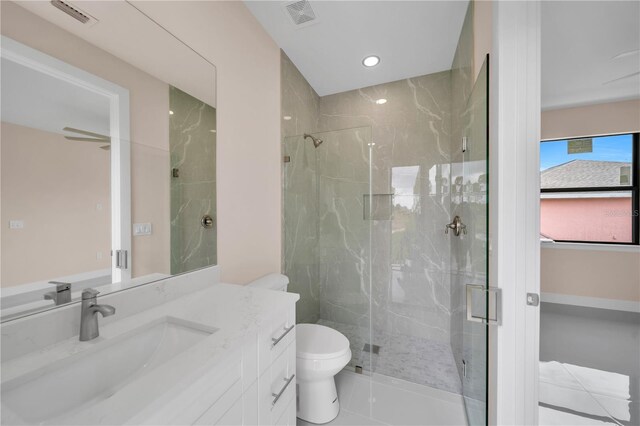 2606 34th St SW, Lehigh Acres, FL 33976 - bathroom with vanity, a marble finish shower, and recessed lighting
