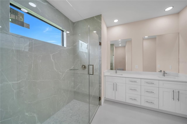 2606 34th St SW, Lehigh Acres, FL 33976 - full bath featuring a marble finish shower, double vanity, and recessed lighting