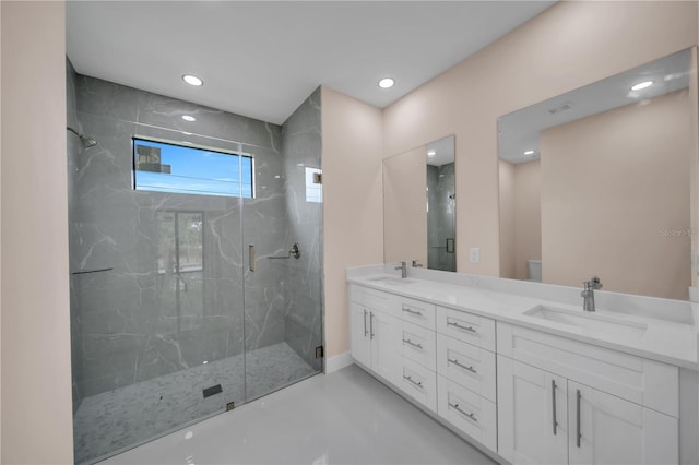 2606 34th St SW, Lehigh Acres, FL 33976 - bathroom featuring a marble finish shower, double vanity, recessed lighting, and finished concrete floors