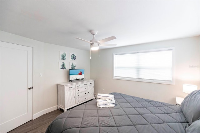 6020 Midnight Pass Rd Unit 49, Sarasota, FL 34242 - bedroom featuring dark wood-type flooring and ceiling fan