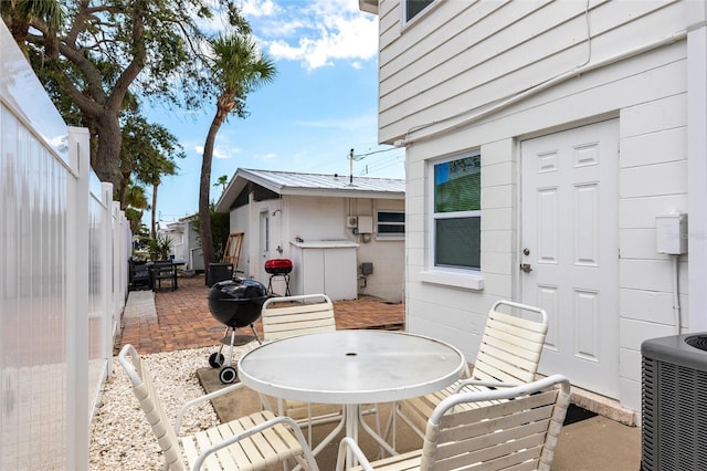 6020 Midnight Pass Rd Unit 49, Sarasota, FL 34242 - view of patio with outdoor dining area and grilling area