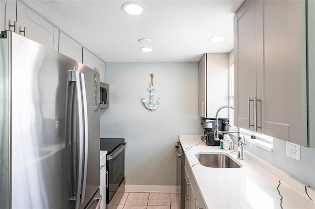 6020 Midnight Pass Rd Unit 49, Sarasota, FL 34242 - kitchen with stainless steel appliances, light tile patterned floors, recessed lighting, and light stone counters
