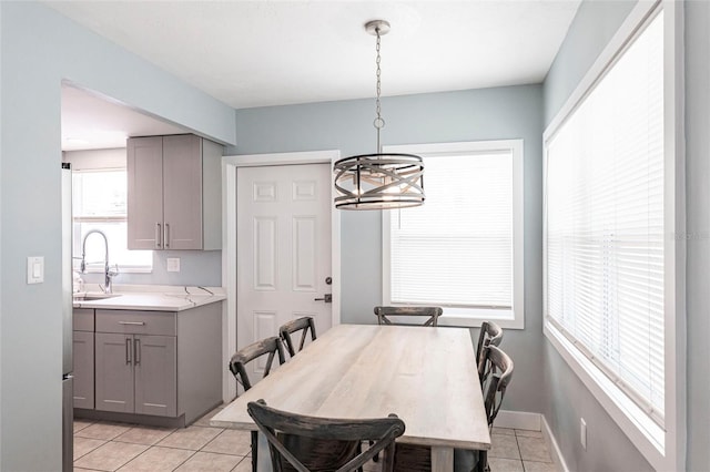 6020 Midnight Pass Rd Unit 49, Sarasota, FL 34242 - dining space with light tile patterned flooring and a chandelier