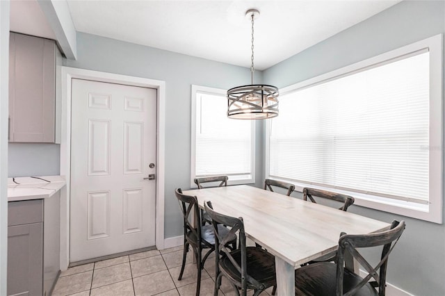 6020 Midnight Pass Rd Unit 49, Sarasota, FL 34242 - dining space featuring a chandelier and light tile patterned floors