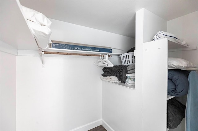 6020 Midnight Pass Rd Unit 49, Sarasota, FL 34242 - walk in closet featuring wood finished floors