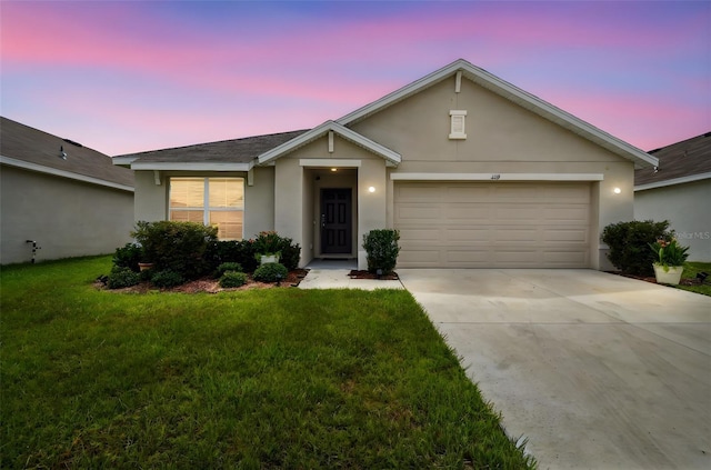 4119 Autumn Amber Dr, Spring Hill, FL 34609 - single story home featuring stucco siding, an attached garage, driveway, and a front yard