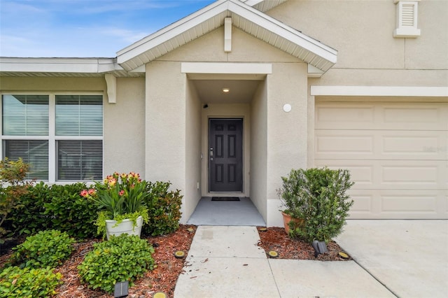 4119 Autumn Amber Dr, Spring Hill, FL 34609 - entrance to property featuring stucco siding and a garage