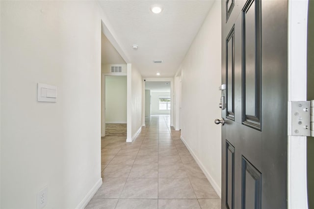 4119 Autumn Amber Dr, Spring Hill, FL 34609 - corridor with light tile patterned floors and recessed lighting