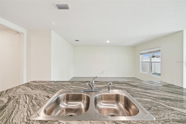 4119 Autumn Amber Dr, Spring Hill, FL 34609 - kitchen view of a textured ceiling and stone counters