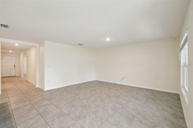 4119 Autumn Amber Dr, Spring Hill, FL 34609 - spare room with recessed lighting, light tile patterned flooring, and a textured ceiling