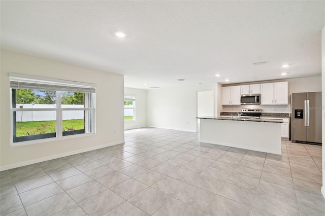4119 Autumn Amber Dr, Spring Hill, FL 34609 - kitchen with appliances with stainless steel finishes, open floor plan, white cabinetry, recessed lighting, and light tile patterned floors