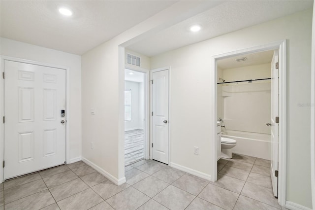 4119 Autumn Amber Dr, Spring Hill, FL 34609 - foyer with light tile patterned floors and recessed lighting
