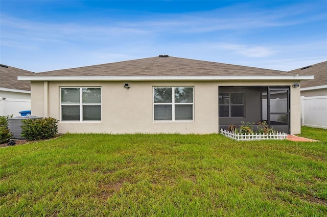 4119 Autumn Amber Dr, Spring Hill, FL 34609 - back of property with stucco siding, a sunroom, and roof with shingles
