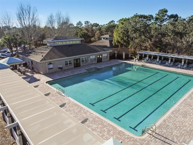 4119 Autumn Amber Dr, Spring Hill, FL 34609 - community pool featuring a patio area