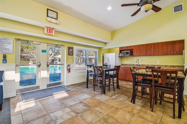 4119 Autumn Amber Dr, Spring Hill, FL 34609 - dining room featuring a ceiling fan and high vaulted ceiling