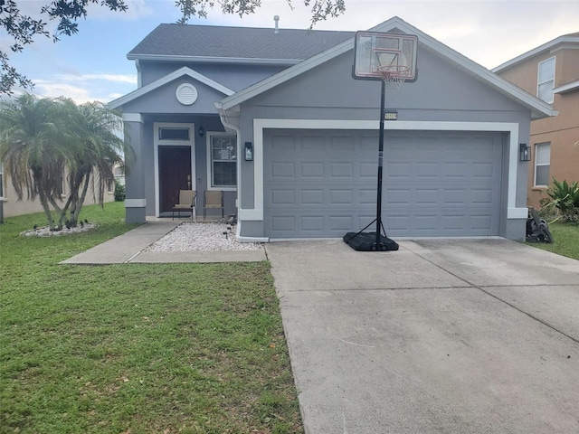 10109 36th Ct E, Parrish, FL 34219 - view of front of home featuring an attached garage, driveway, stucco siding, and a front lawn