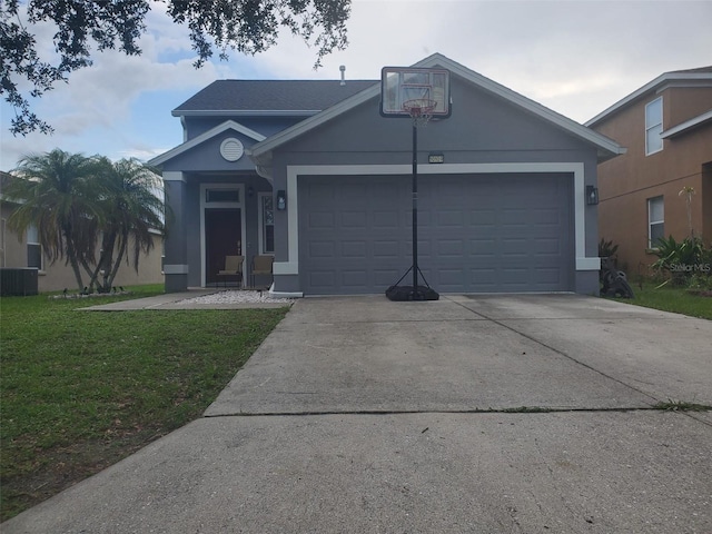 10109 36th Ct E, Parrish, FL 34219 - single story home with a garage, driveway, a front lawn, and stucco siding