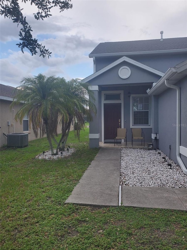 10109 36th Ct E, Parrish, FL 34219 - entrance to property with a lawn, stucco siding, and covered porch