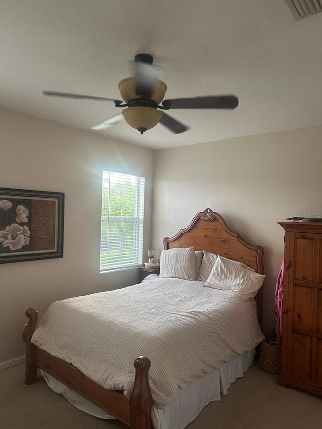 10109 36th Ct E, Parrish, FL 34219 - bedroom featuring light colored carpet and a ceiling fan