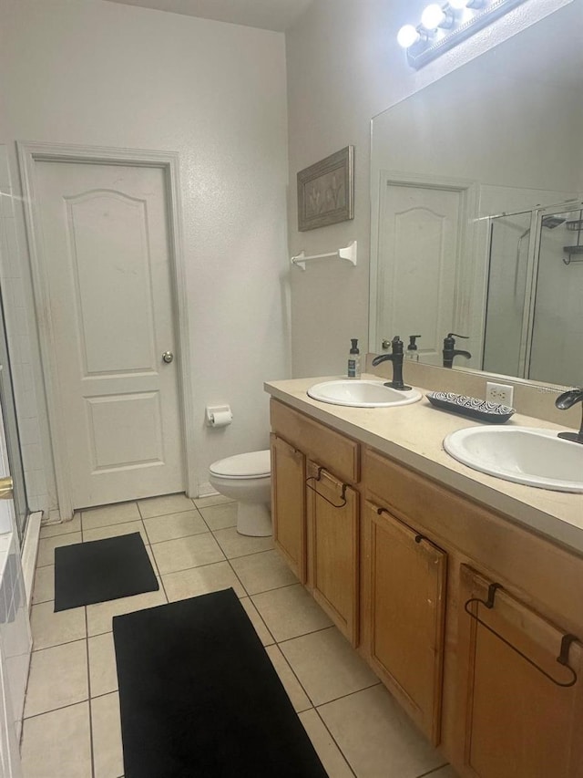 10109 36th Ct E, Parrish, FL 34219 - full bath featuring a shower stall, tile patterned flooring, and double vanity