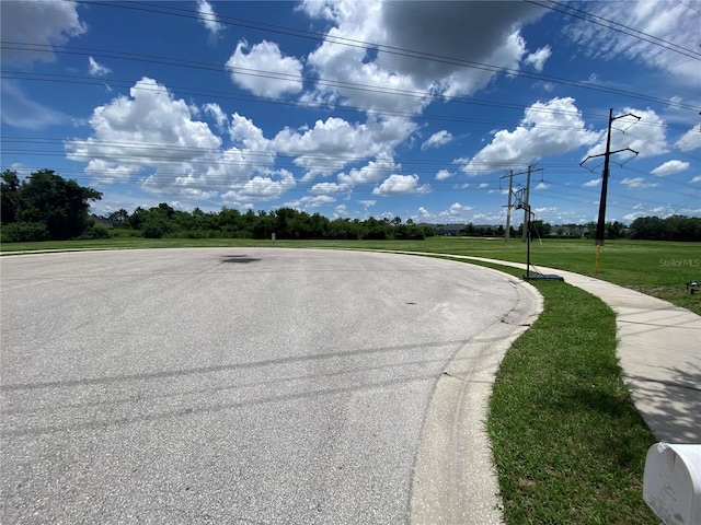 10109 36th Ct E, Parrish, FL 34219 - view of asphalt street featuring sidewalks and curbs