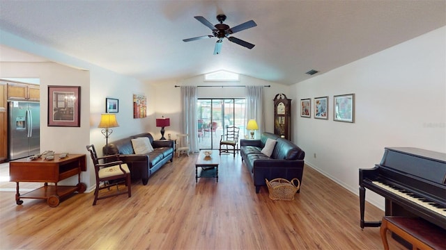 2215 Toniwood Ln, Palm Harbor, FL 34685 - living area featuring vaulted ceiling, light wood finished floors, and a ceiling fan