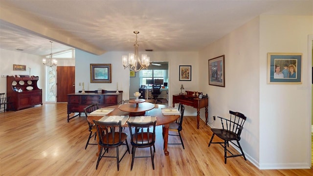 2215 Toniwood Ln, Palm Harbor, FL 34685 - dining area featuring a chandelier and light wood-style floors