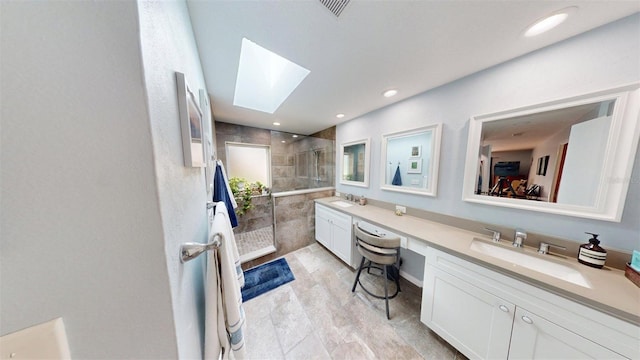 2215 Toniwood Ln, Palm Harbor, FL 34685 - full bath with double vanity, a tile shower, a skylight, and recessed lighting
