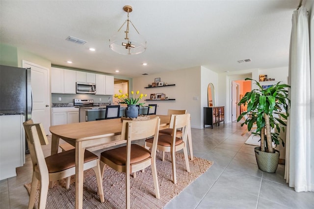 13304 Mylion Way, Spring Hill, FL 34610 - dining space featuring recessed lighting and light tile patterned floors