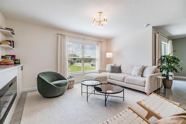 13304 Mylion Way, Spring Hill, FL 34610 - living room with a chandelier, a glass covered fireplace, and a textured ceiling