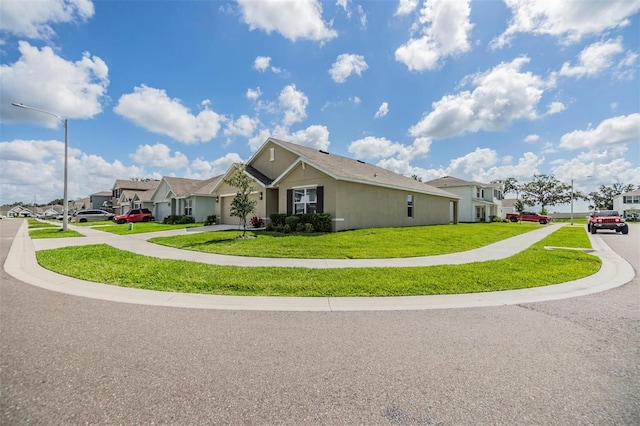 13304 Mylion Way, Spring Hill, FL 34610 - view of side of home featuring a residential view and a lawn