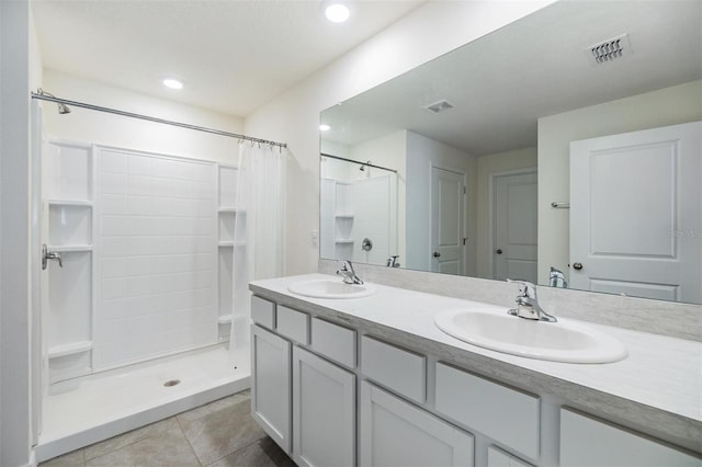 13304 Mylion Way, Spring Hill, FL 34610 - bathroom with double vanity, tile patterned flooring, curtained shower, and recessed lighting