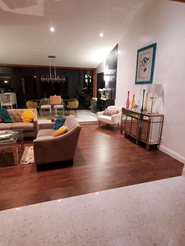 5017 E 127th Ave, Temple Terrace, FL 33617 - living room featuring lofted ceiling and wood finished floors